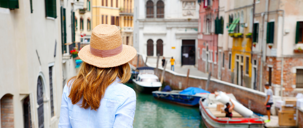 woman looking over canal